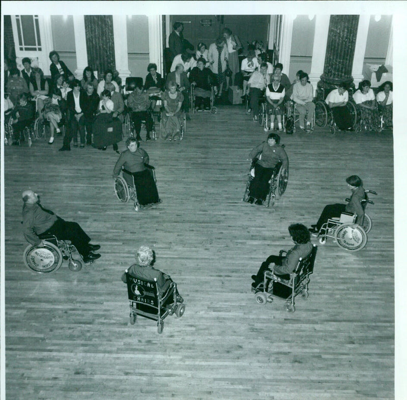 Oxford Wheelchair Dancers compete in a Musical Chairs dance competition. - Vintage Photograph