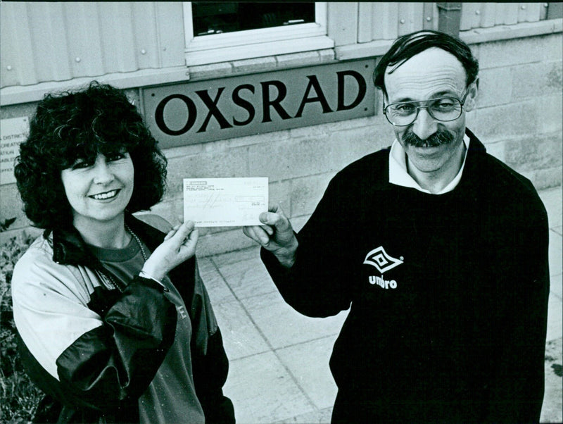 Bonnie Cox of Norgine Ltd presents a cheque to Paul Salway of Oxsrad. - Vintage Photograph