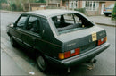 An abandoned Volvo car in St Peter's Rd, Wolvercote, with a 'Police Aware' sticker placed on its rear. - Vintage Photograph