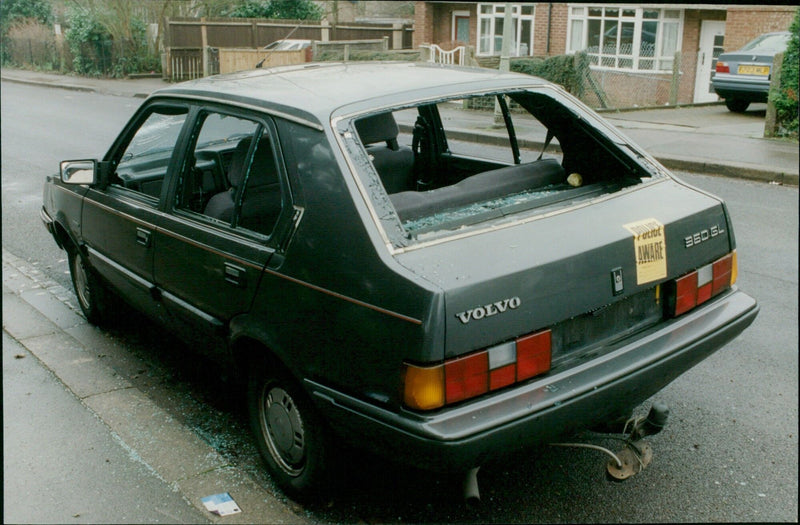 An abandoned Volvo car in St Peter's Rd, Wolvercote, with a 'Police Aware' sticker placed on its rear. - Vintage Photograph