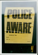 A smashed and abandoned Volvo car is seen in St. Peters Road, Wolvercote, with a "Police Aware" sticker placed on its rear. - Vintage Photograph