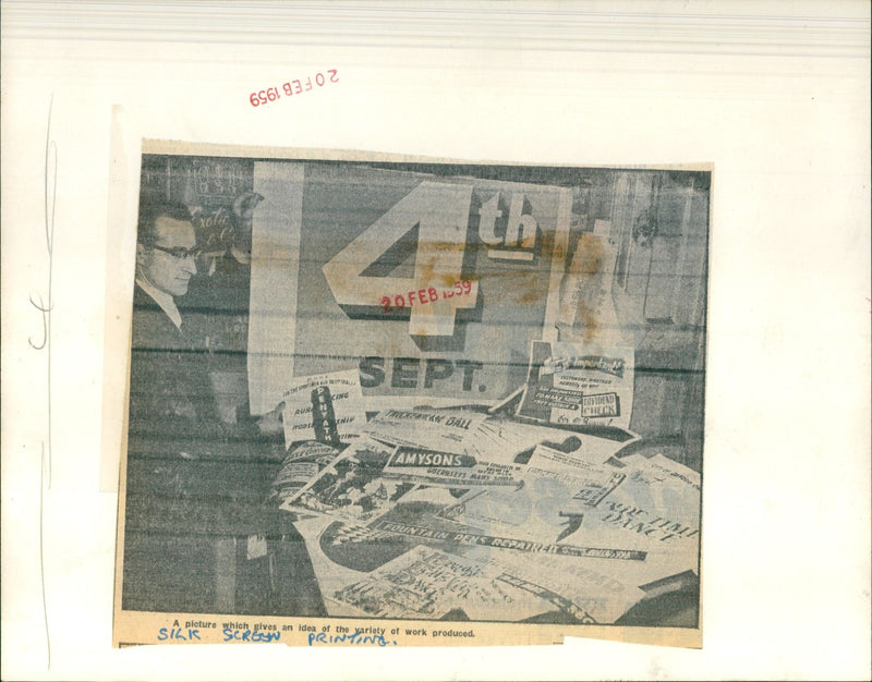 Variety of work is displayed in a silk screen printing studio. - Vintage Photograph