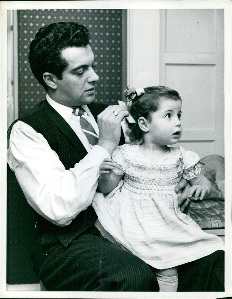 Musician Frankie Vaughan poses with 20-month old Susan, promoting a message of human equality and understanding. - Vintage Photograph