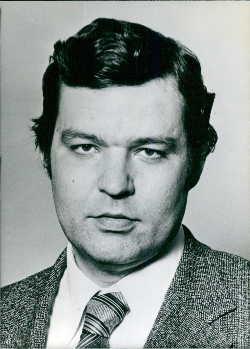 Finland's Minister of Trade and Industry, Eero Rantala of the Social Democratic Party, attends a press conference in Helsinki. - Vintage Photograph