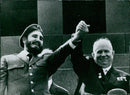 Cuban leader Fidel Castro and Soviet Union's Nikita Khrushchev pose for a photo during Castro's visit to the Soviet Union in April 1964. - Vintage Photograph