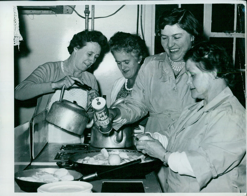 Community members prepare hot dogs at a Hill Rose Hill Community Association event. - Vintage Photograph