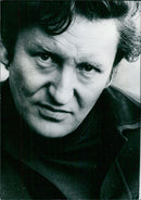 British writer Michael Molroyd poses with his books in London, 1974. - Vintage Photograph