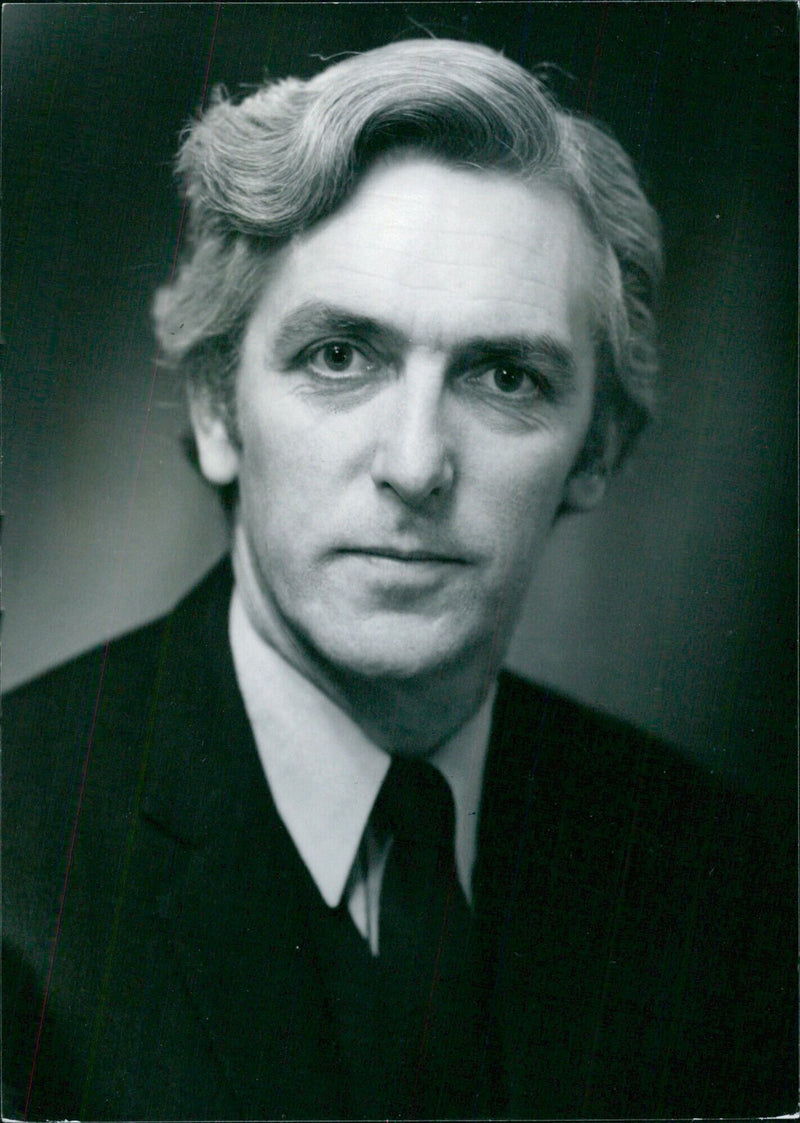 British academics Dr. John Rae (born 1931) and Headmaster of Westminster School since 1970, poses for a portrait in 1974. - Vintage Photograph