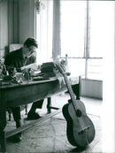 International fashion model Jacques Charrier poses in a stylish black ensemble in the heart of Paris. - Vintage Photograph