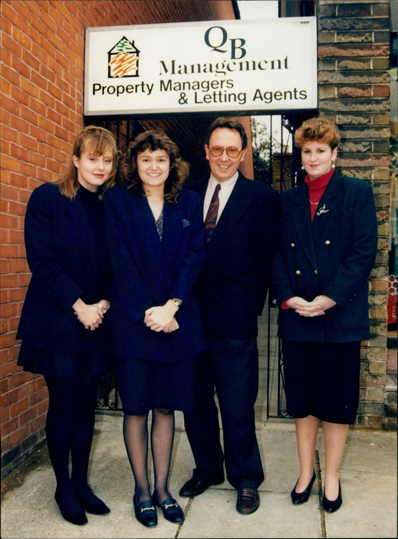 QB Management Property Managers & Letting Agents staff in a meeting. - Vintage Photograph