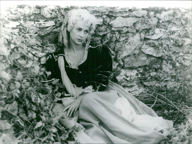 Martine Carol is pictured at a film premiere in Paris, France. - Vintage Photograph