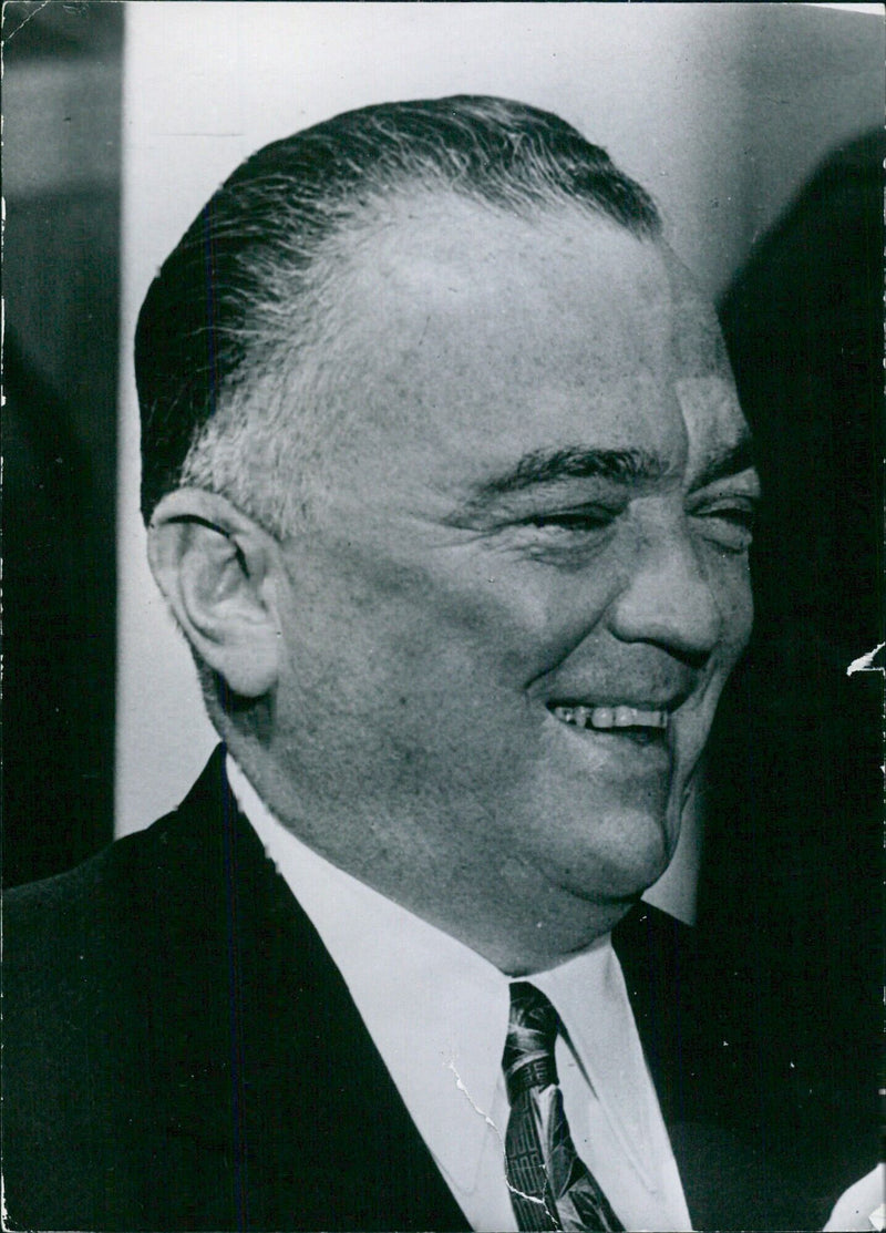 John Edgar Hoover, Director of the Federal Bureau of Investigation, smiles for the camera in this photo taken by Camera Press (H&E) London in 1957. - Vintage Photograph