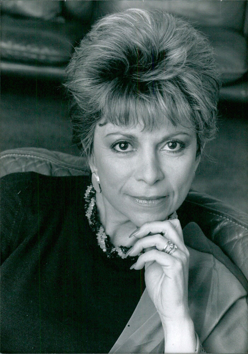 Chilean writer Isabel Allende is celebrated at a launch event for her new book, Eva Luna. - Vintage Photograph