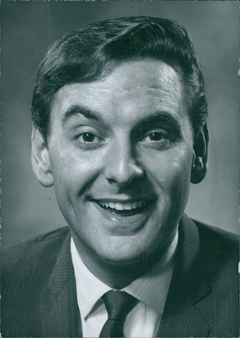 British screenwriter Bob Monkhouse poses for a portrait study on November 21, 2021. - Vintage Photograph