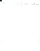 In this picture taken in Sweden, a man is seen holding a movie camera while standing in front of a film set. - Vintage Photograph