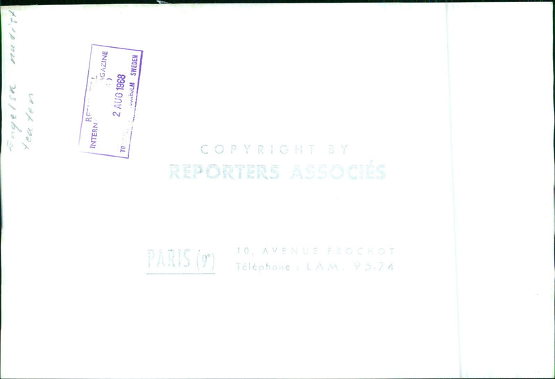 A group of men and women enjoy the summer sun in the nude at a beach in Hulm, Sweden, on August 2, 1968. - Vintage Photograph