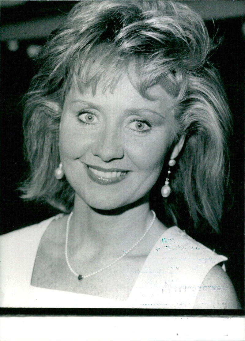 British singer and entertainer Lulu, born Marie Laurie in Glasgow in 1946, performs at a concert. - Vintage Photograph