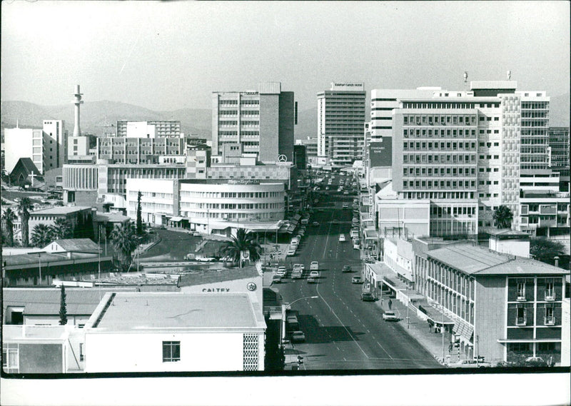 A general view of Kaiserstrasse, the main street and business center of Windhoek, Namibia, is seen in this photograph taken by Jan Kopec for Camera Press London. - Vintage Photograph