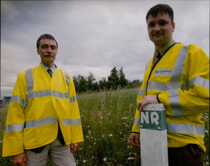 Ecologist Craig Blackwell and Environmental Advisor Michael Fargher survey Boors Hill Nature Reserve on a traffic island. - Vintage Photograph