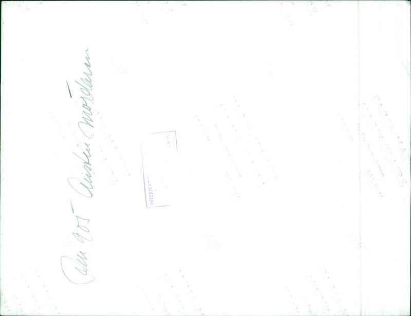 In this photograph, a man is seen holding an Instamatic F camera, ready to have the film developed. - Vintage Photograph