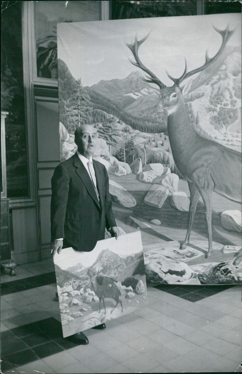 French fashion designer Franco DALMAS poses with a model wearing one of his creations in Stockholm, Sweden on July 26, 1961. - Vintage Photograph