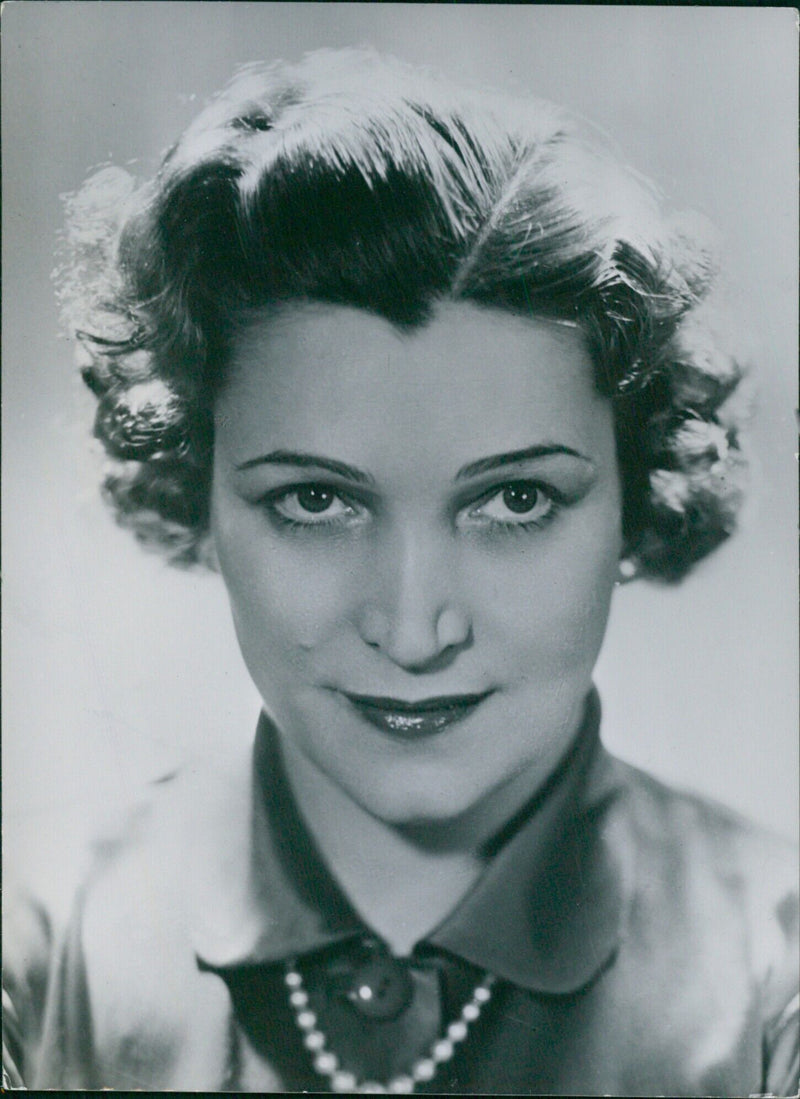 French actress Germaine Rouer poses for a portrait study by Harcourt ahead of her potential candidacy in the 1953 French Presidential Elections. - Vintage Photograph