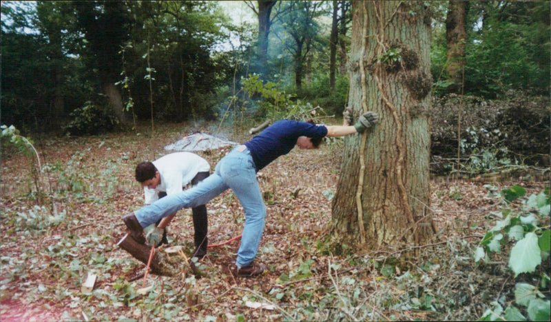 A volunteer helps to restore a nature reserve in the UK. - Vintage Photograph