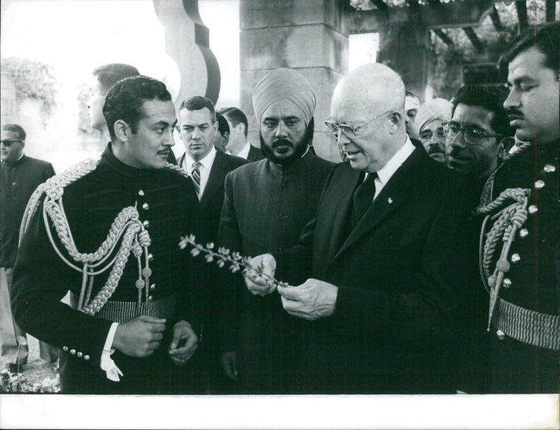 Pakistani Prime Minister, Muhammad Ali Bogra, shakes hands with India's Prime Minister Jawaharlal Nehru during a visit to Islamabad in 1959. - Vintage Photograph