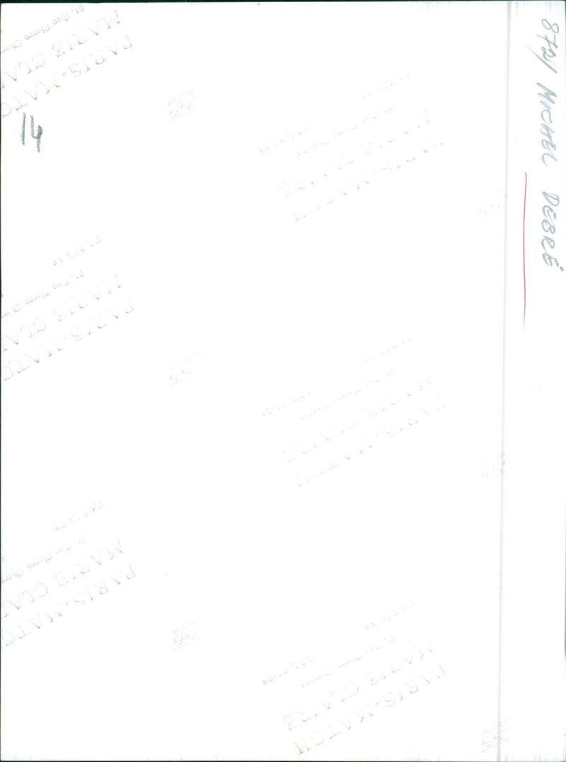 A man stands amongst a crowd of protesters in Paris, France, holding a sign that reads "Tohal 8727 Michel Debre", as they demonstrate against the government. - Vintage Photograph