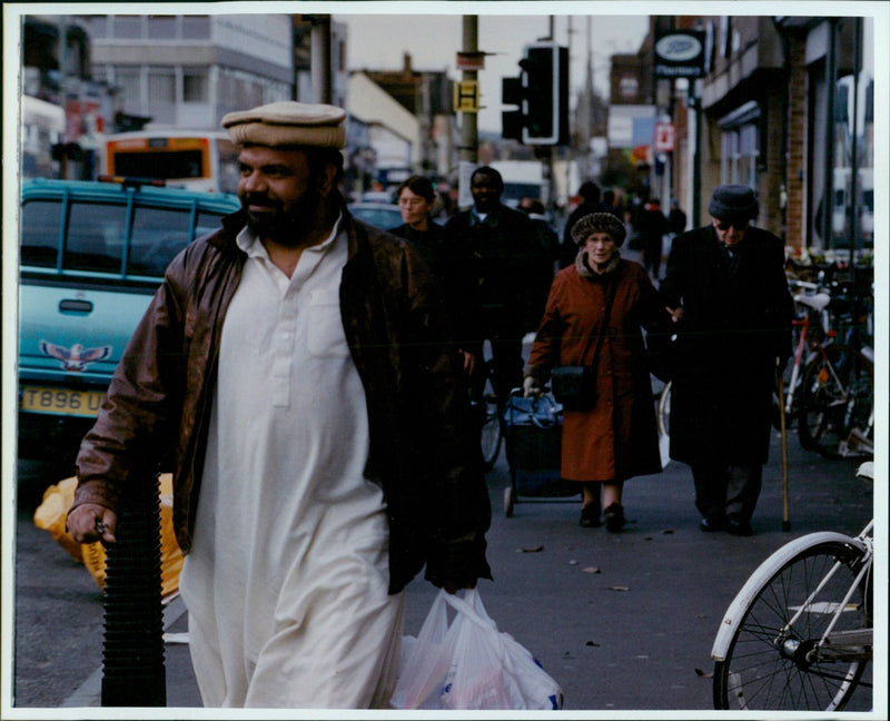 Ranjiv Angrish brings in stock at the Bombay Emporium in Cowley Road, Oxford. - Vintage Photograph