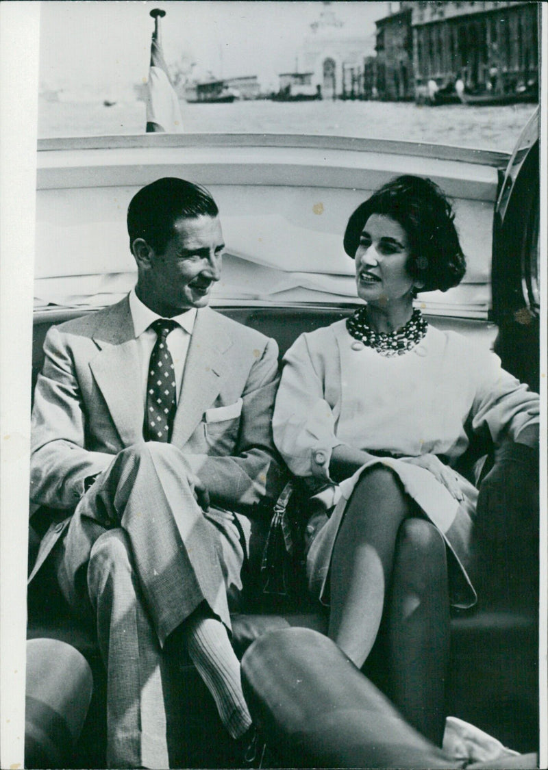 Marquis de Villaverde and his wife, formerly Carmen Franco, General Franco's only daughter, enjoy a motor-boat tour of the Venice canals. - Vintage Photograph