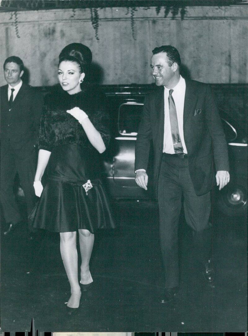 Actors Jack Lemmon and Joan Collins enjoying a night out in Rome, Italy on October 16, 1961. - Vintage Photograph