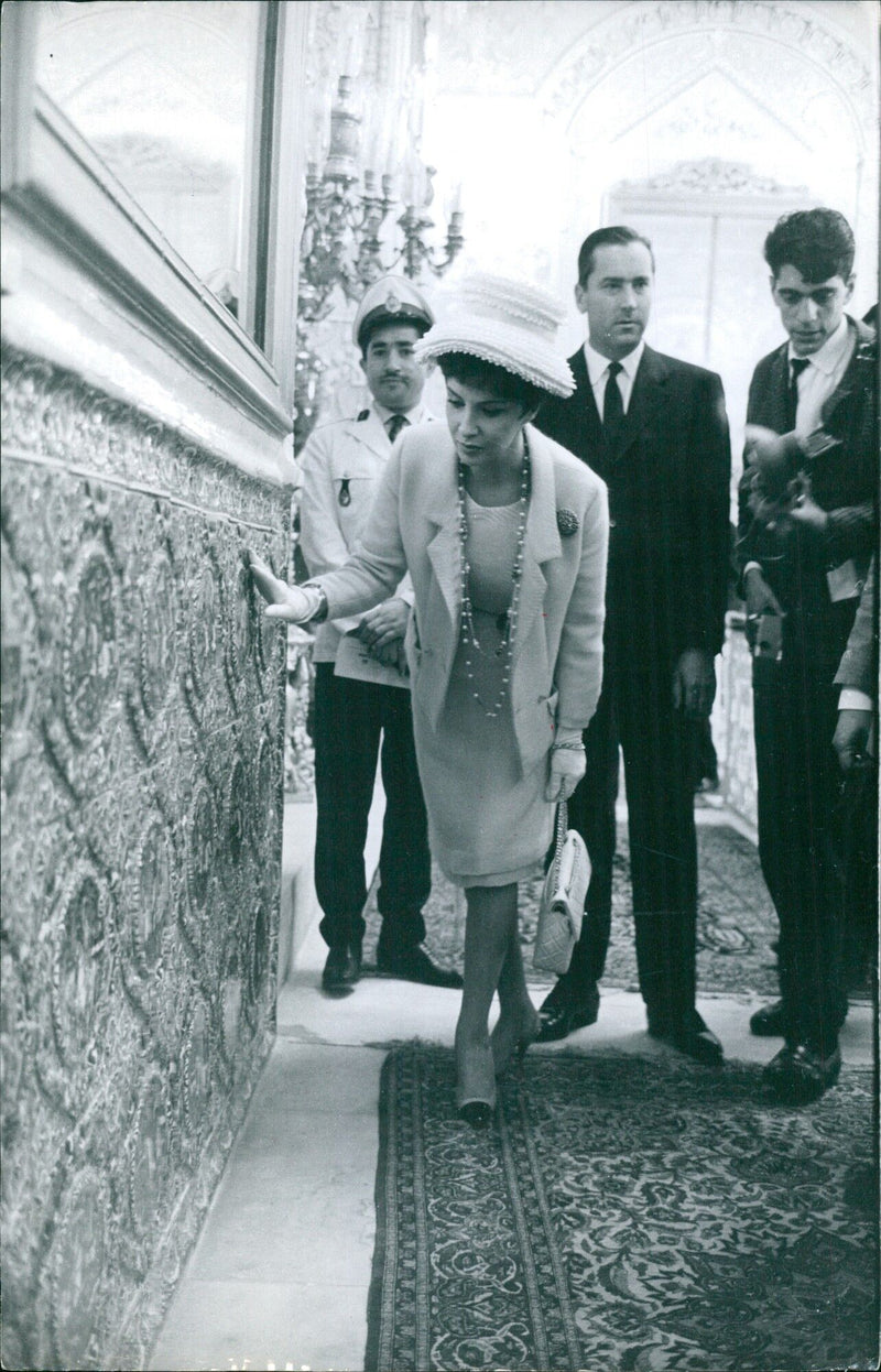 Italian actress Gina Lollobrigida poses for a photoshoot in Rome, Italy in 1963. - Vintage Photograph