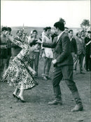 People gather on the Champs-Elysées in Paris, France on 19-30 4 to enjoy the sights and sounds of the iconic avenue. - Vintage Photograph