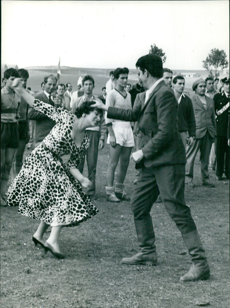 People gather on the Champs-Elysées in Paris, France on 19-30 4 to enjoy the sights and sounds of the iconic avenue. - Vintage Photograph