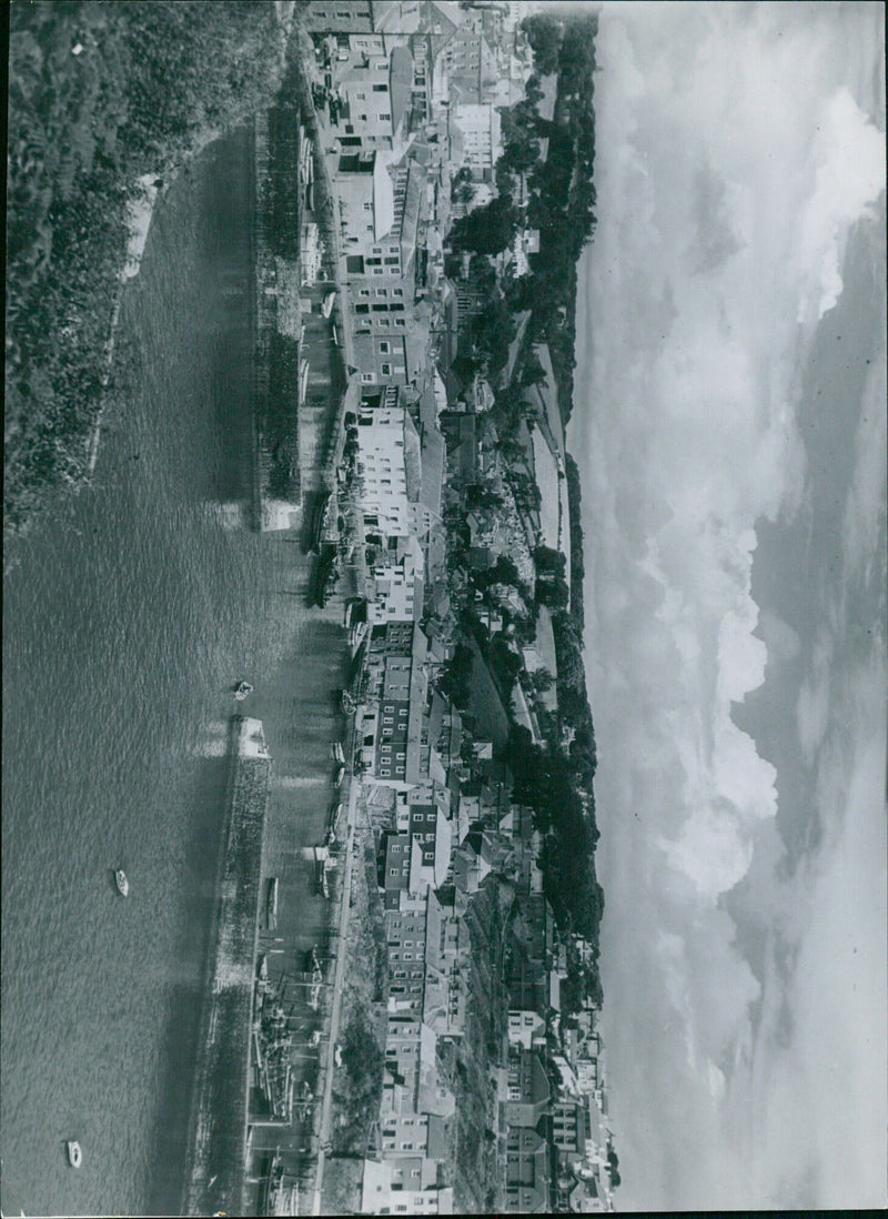 A group of people is seen participating in the 10 LE BOB BBB ΠΕΙ FE 44 Negative Na event, which is held annually in this location. - Vintage Photograph