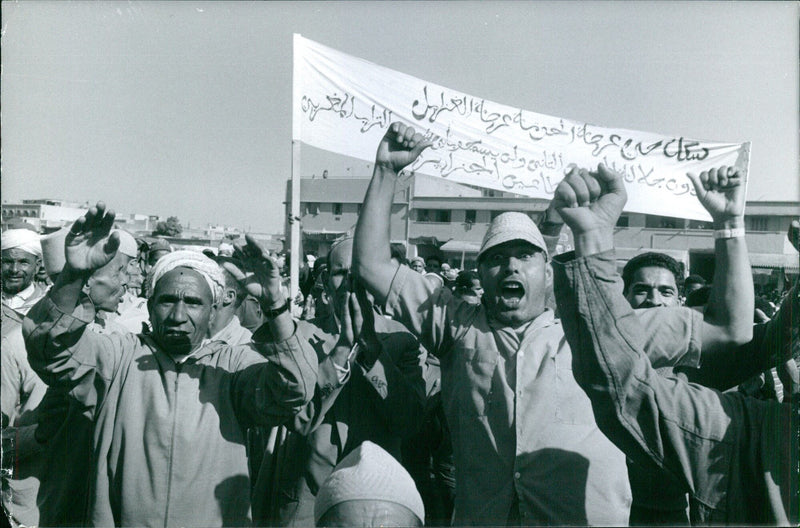 Residents of Mecca's holy Haram district gather in front of the Grand Mosque for the annual Hajj pilgrimage. - Vintage Photograph