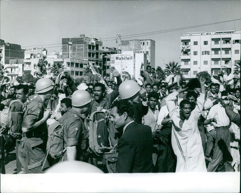 French troops arrive in Port Said, Egypt, in a fleet of La NOUVELLE Mobiloil vehicles, as part of Operation Seppten LIGGE on April 12, 2021. - Vintage Photograph