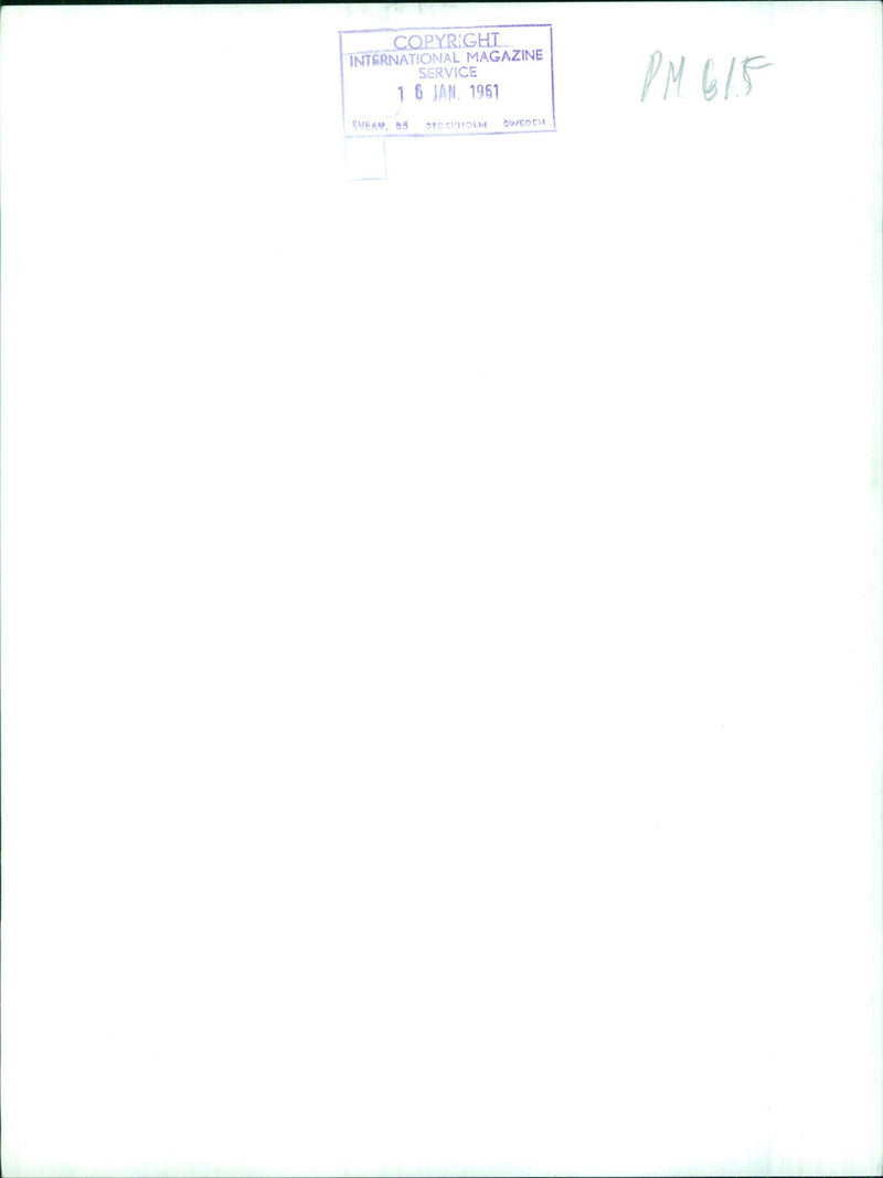 A group of people gather outside the Sveam 85 building in Stockholm, Sweden on January 6, 1961. - Vintage Photograph