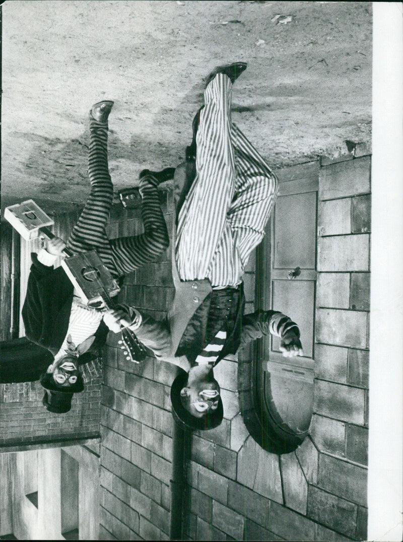 In this image taken in Paris on 2021-07-29, an individual is seen looking at a display in a store. - Vintage Photograph