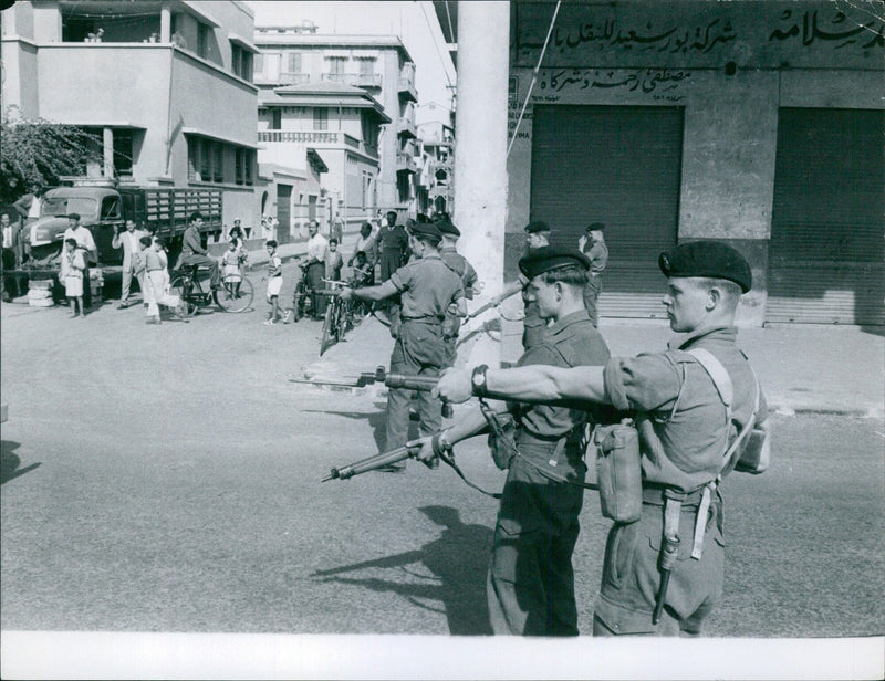 Members of the Borasaid Shipping Company, led by Mustafa Rahman and accompanied by 1001 curious onlookers, celebrated the launch of their newest vessel, the ARCONS ION THMA, in Port Said, Egypt. - Vintage Photograph