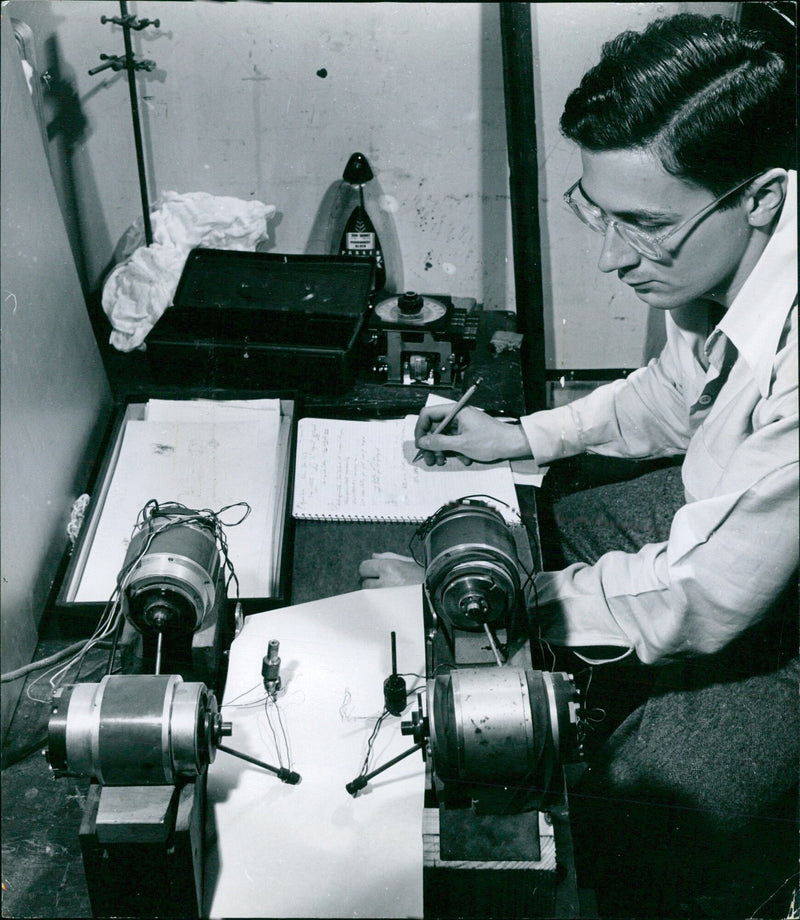 A technician monitors a two-channel Selsyn Recorder, used to record the movement of animals, in a laboratory at Dansgårdspinde 1 in Copenhagen, Denmark. - Vintage Photograph