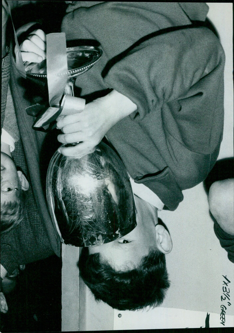 Police officers apprehend a suspect in a bar in London. - Vintage Photograph