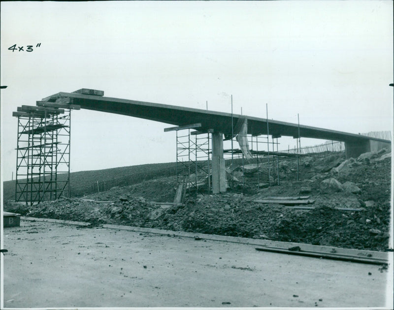 Construction workers lay asphalt on the Eastern By-Pass in Oxford, England. - Vintage Photograph