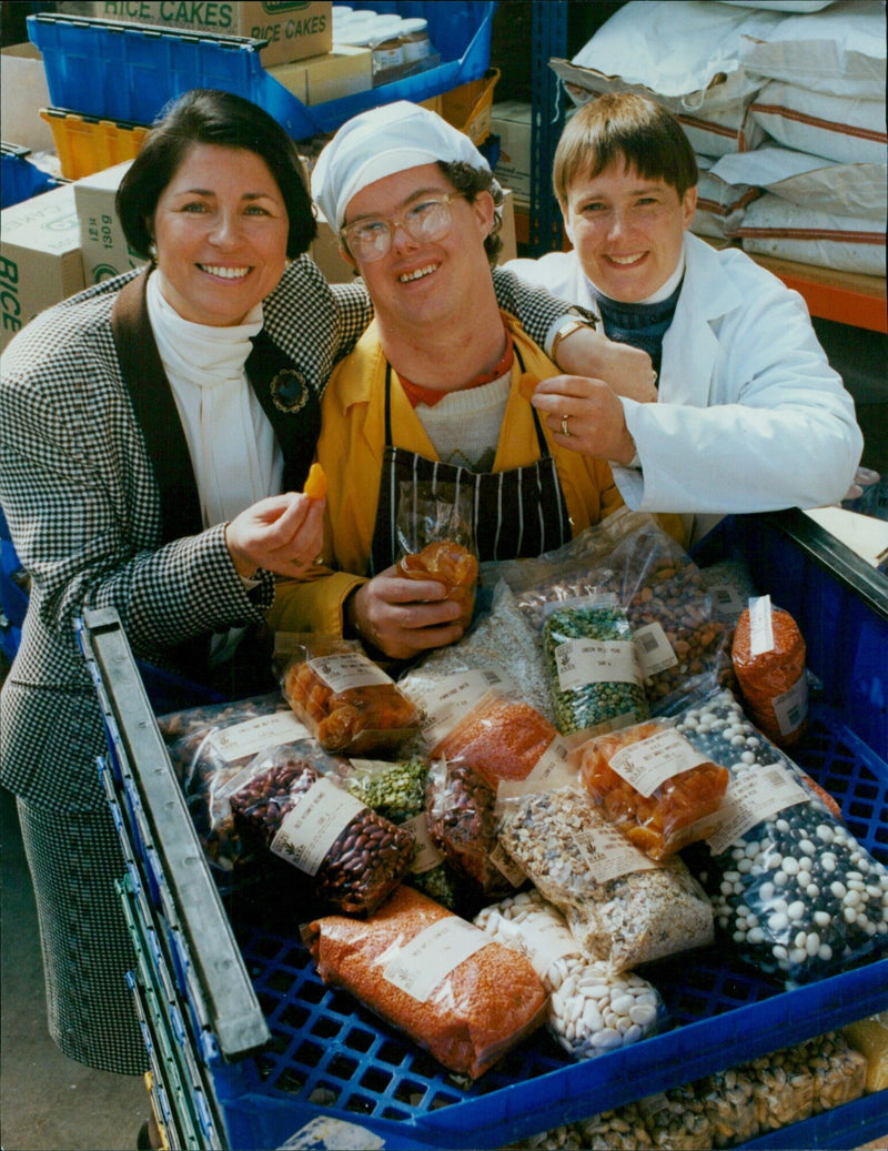 Employees of Oxford Wholefoods pose with some of their products. - Vintage Photograph