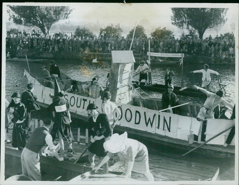 Oxford rowing men take part in the annual rag regatta on the Isis. - Vintage Photograph