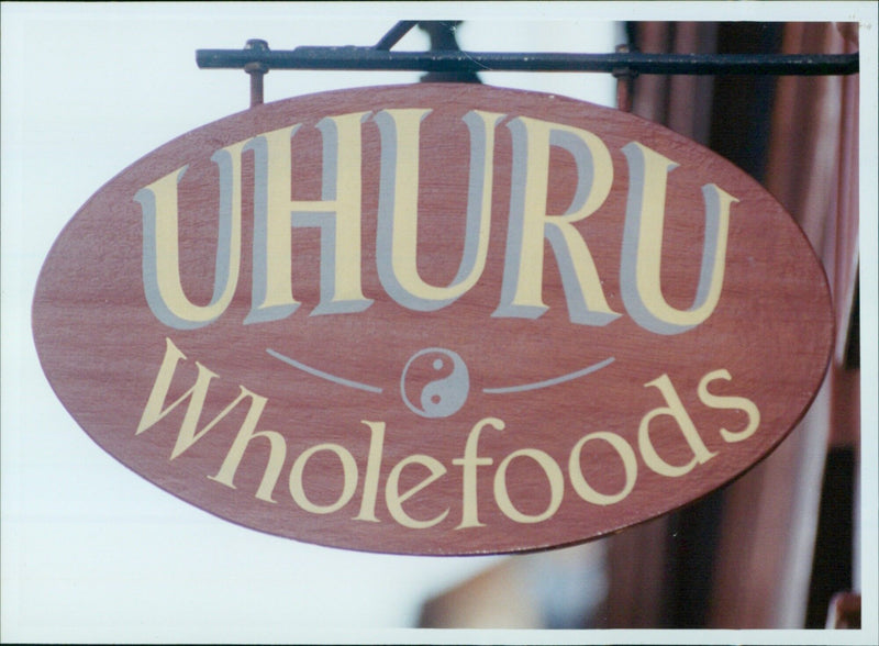 Annette Mngxitama serves a customer at Uhuru Wholefoods in Oxford. - Vintage Photograph