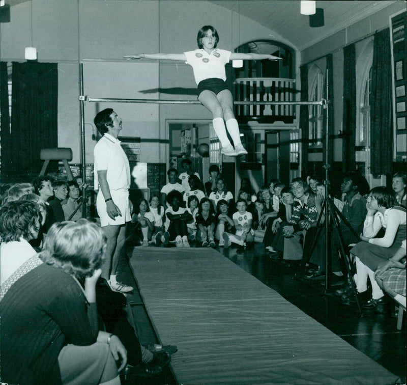 Maxine Ferracini performs a tumbling leap during a gymnastics display. - Vintage Photograph