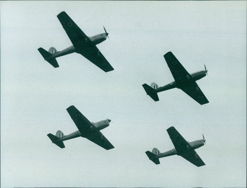 Four Chipmunks from the University Air Squadron fly in formation during their farewell fly-past at Bicester Royal Air Force Station. - Vintage Photograph