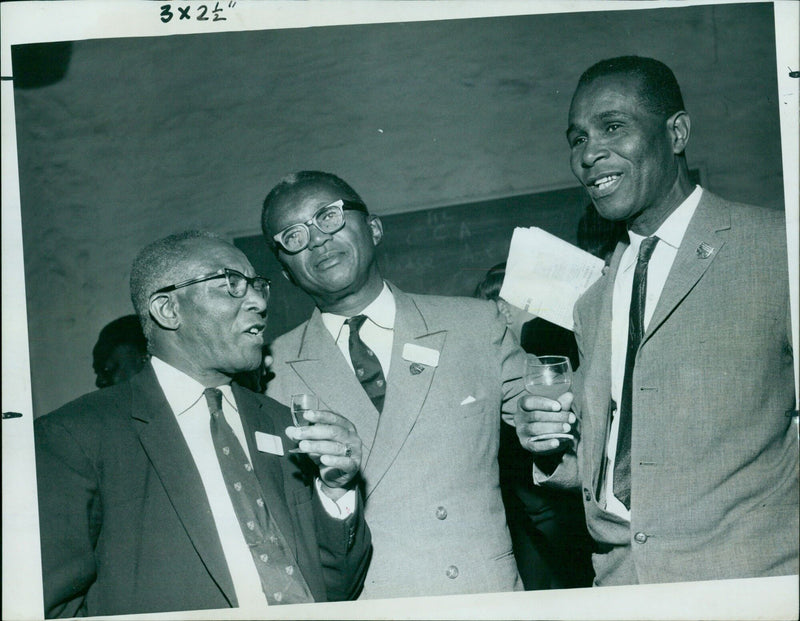 Three West Indian parliamentarians attending a reception in Queen Elizabeth House in Oxford. - Vintage Photograph